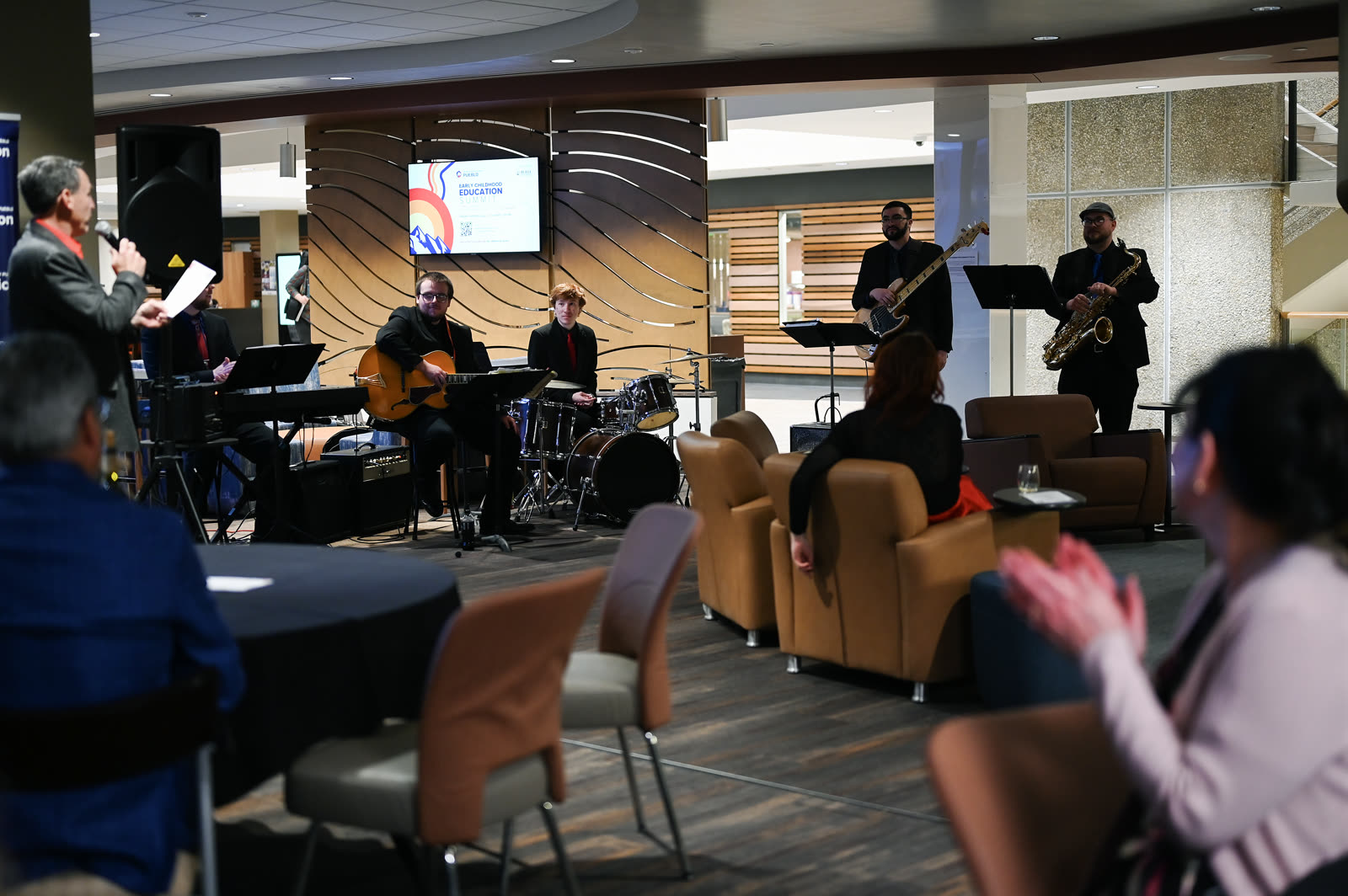 5 O'Clock Five performing for a seated audience