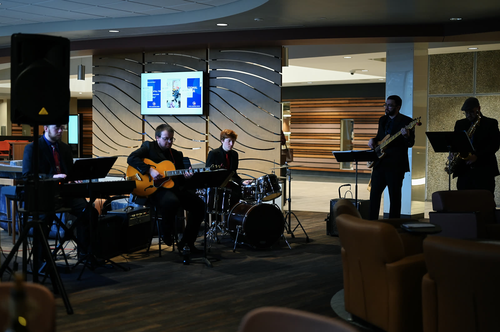 Full band performing in an event lounge