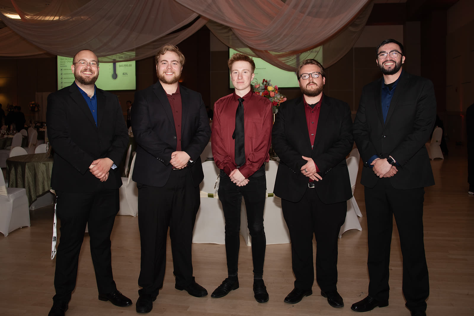 5 O'Clock Five posing together at an event