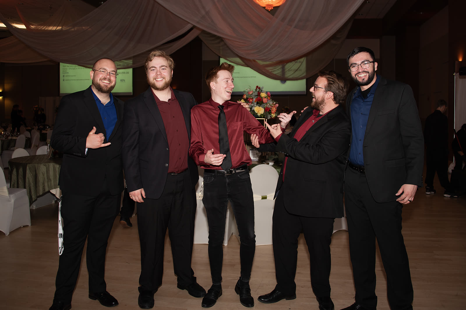 5 O'Clock Five group portrait at a reception